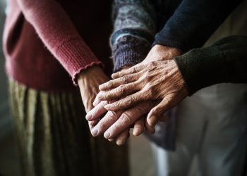 Closeup of hands of group of seniors